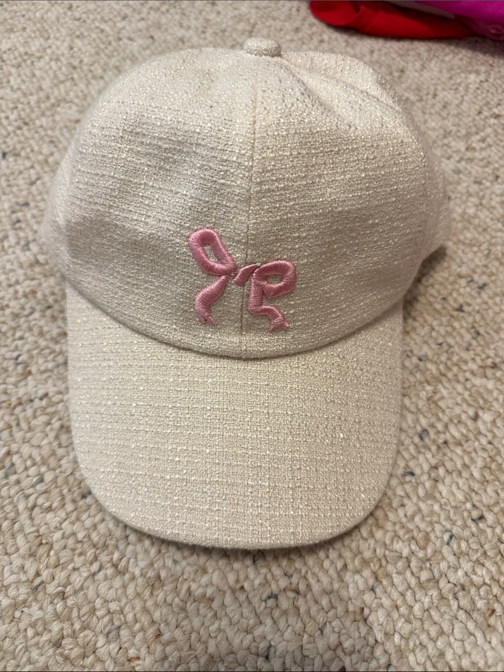 Cream Baseball Cap with Pink Embroidered Bow Accent